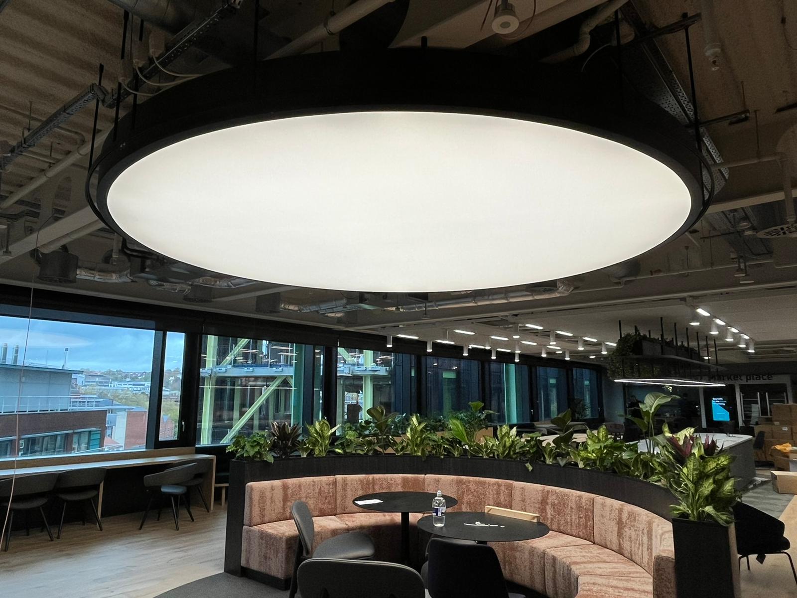 Bright meeting room with illuminated fabric ceilings